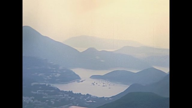 Aerial view of Aberdeen port and bay from overlook on top of the The Peak Galleria terrace. Hong Kong China, Historic restored footage on 1980.