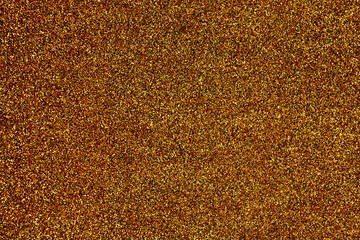 golden background with sparkles texture of large resolution yellow shiny and iridescent sequins with lights and light background