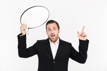 Portrait of an excited young businessman dressed in suit