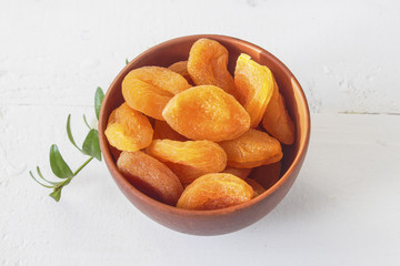 sweet big fleshy fruit dried apricots in a bowl