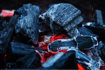 red-hot charcoals prepared for a barbecue, close up