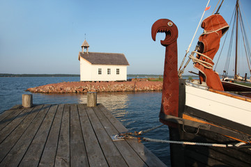 Viking boat and chapel in shipyard in Marienhamn
