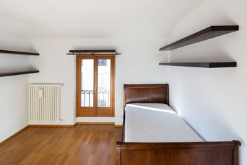 Empty new bedroom, only with wooden bed