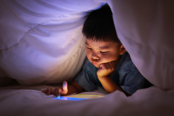 Kid using tablet play learning application games.