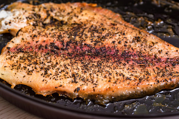 Roasting fish fillet on frying pan close