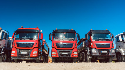 Obraz na płótnie Canvas Trucks standing in line on premises of freight forwarding company