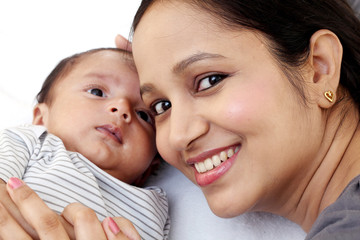Cheerful young mother with baby 