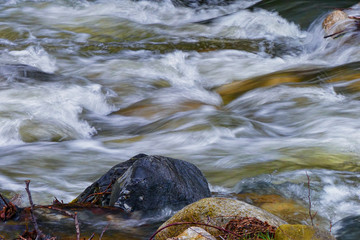 River water with rocks and waterfalls