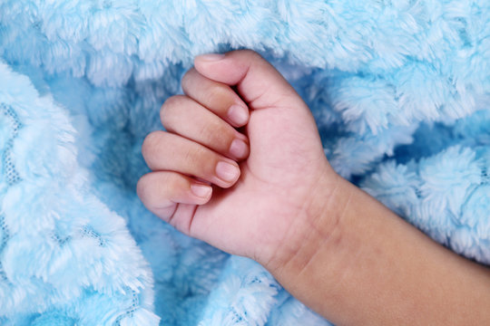 Close up of a newborn baby's fist