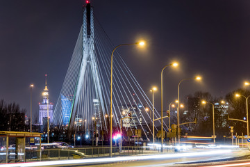 Night panorama of Warsaw skyline with bridge in foreground - 194153801