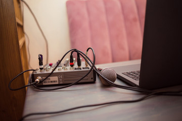 Professional audio sound equipment with microphone and laptop on a table