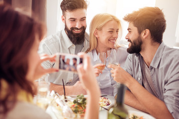 Group of friends doing selfie during lunch