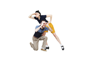 Dancers are looking for something. Boogie or lindy hop in a studio background. Dance for rock-n-roll music.