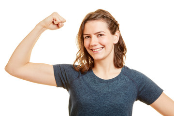 Fototapeta premium Starke Frau spannt Muskeln im Arm an
