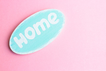 Wooden nameplate with the word home