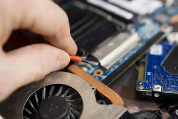 engineer is repairing the laptop. Service laptop. Computer and Electronics Repair.