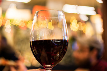 glass of red wine with the Bokeh 
