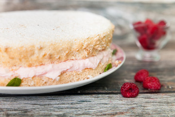 Fresh biscuit cake with raspberry yoghurt cream