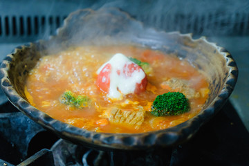 Tamato soup in clay pot at restaurant