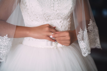 Portrait of tender blonde bride preparing to a wedding day