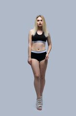 Naklejka premium in full growth.beautiful girl in sport swimsuit.