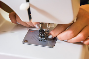 Woman preparing the sewing machine