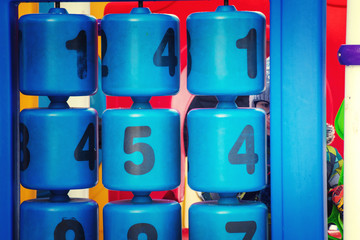 Kid plays with numbers on playground