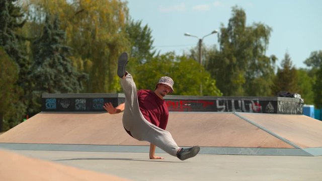Man breakdancing in a skate park