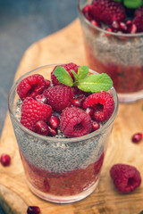 Chia seed pudding with fresh raspberries and pomegranates