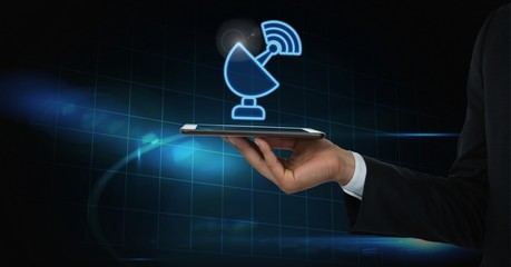 Hand holding tablet with signal icon