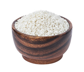 Risotto rice in wooden bowl isolated on white background