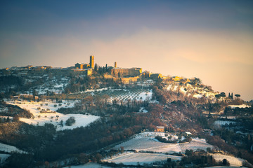 Snow in Tuscany, Radicondoli village, winter panorama. Siena, Italy