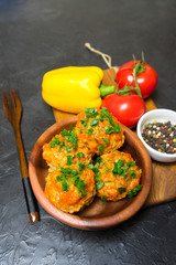 Meatballs with rice and meat in a wooden dish. Place for your text.