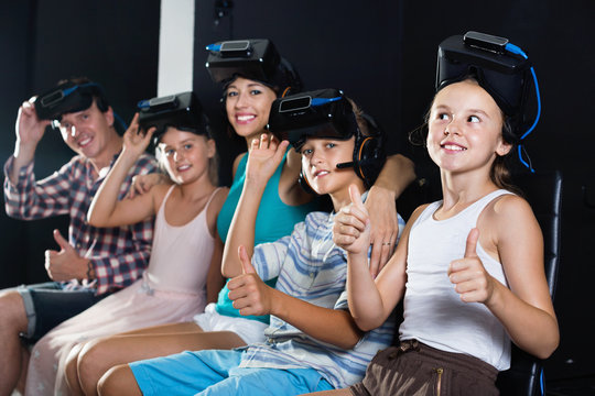 Family of five is satisfied of VR together in the room.