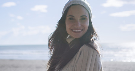 Girl In Autumn Clothes Smiling on beach
