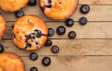 Homemade Blueberry Muffins on a Rustic Wood Table