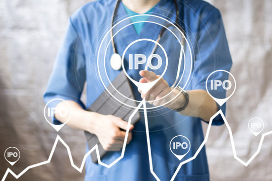 Doctor pushing button ipo Initial Public Offering on chart healthcare network on virtual panel medicine