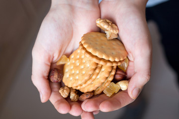 cookies and nuts in children's hands