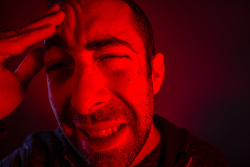 Fototapeta premium Man is suffering in pain from headache