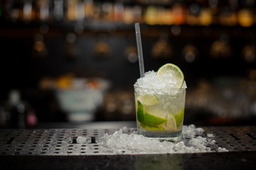Cocktail glass filled with fresh and cool Caipirinha cocktail