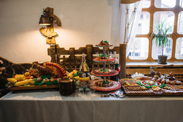 Smoked and baked meet with vegetables stand on the table