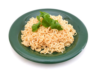 Egg noodles, isolated in plate on white background.