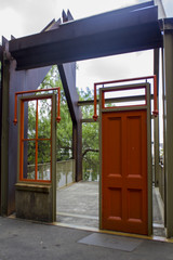 Red door and window leading to empty room