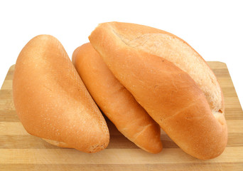 breads on wooden board on a white background