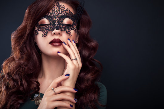 Beautiful Woman With Perfect Make-up And Manicure Wearing A Lace Mask