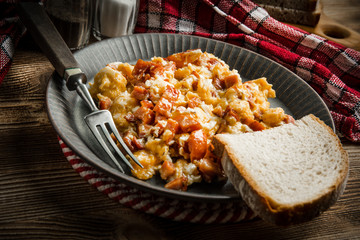 Scrambled eggs with sausage.