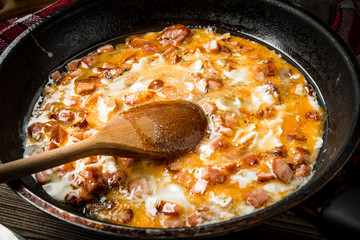 Scrambled eggs with sausage.