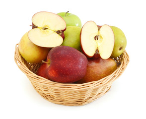 Apples and pears in a straw basket isolated on white background