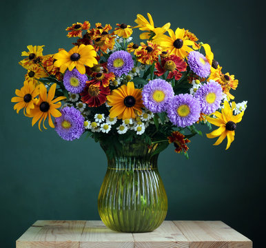 Garden Flowers In A Glass Vase.