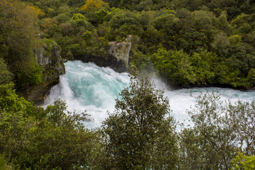 Fototapeta na wymiar Turquoise blue powerful waterfall, Huka Falls, New Zealand